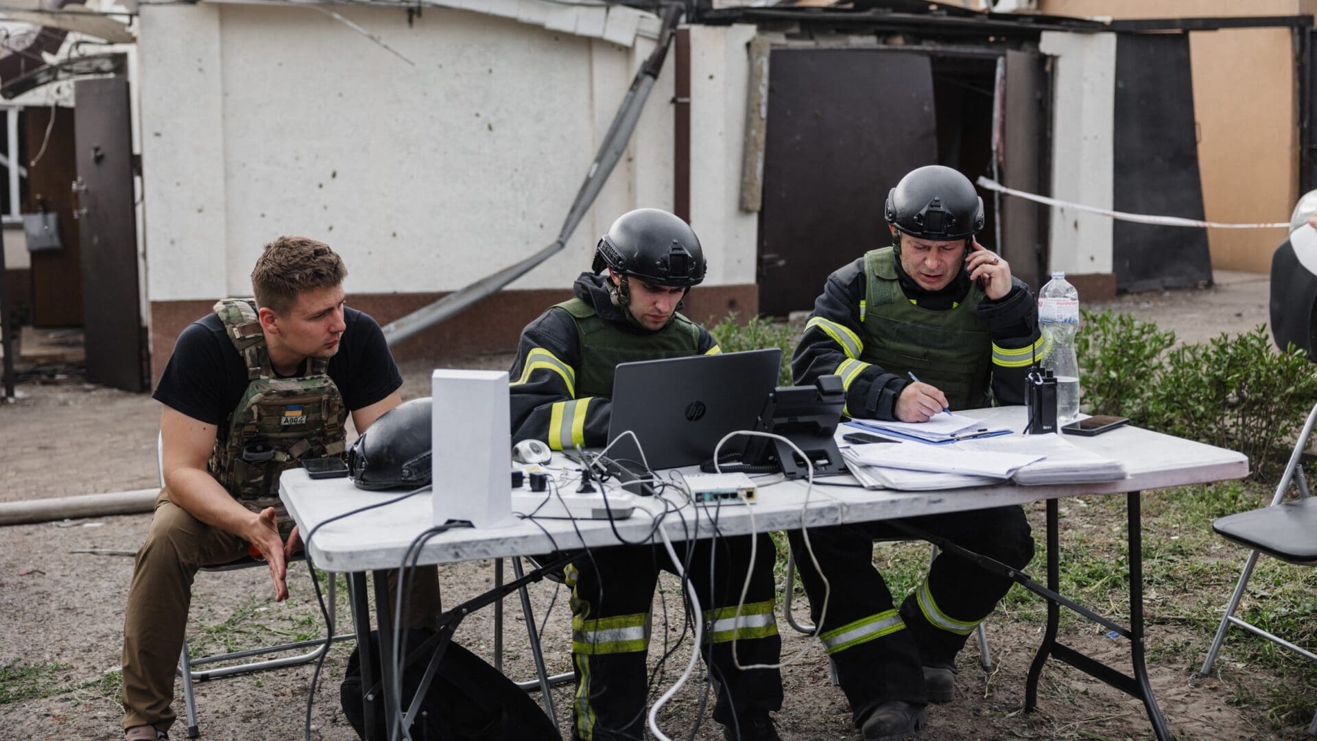 Officials try to assess the damage following a Russian missile attack on residential area in Dnipro, Ukraine on 4 June 2024.