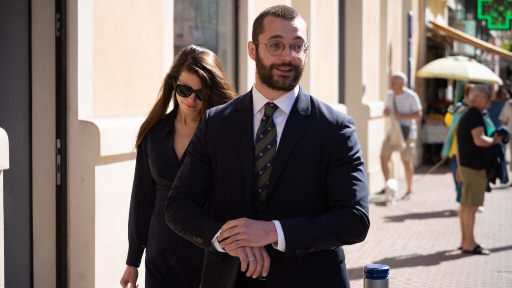Louis Sarkozy walks through the streets of Menton with his wife Natali Husic before the book signing of his book on Napoleon Bonaparte in Menton in the South of France on May 15, 2025.