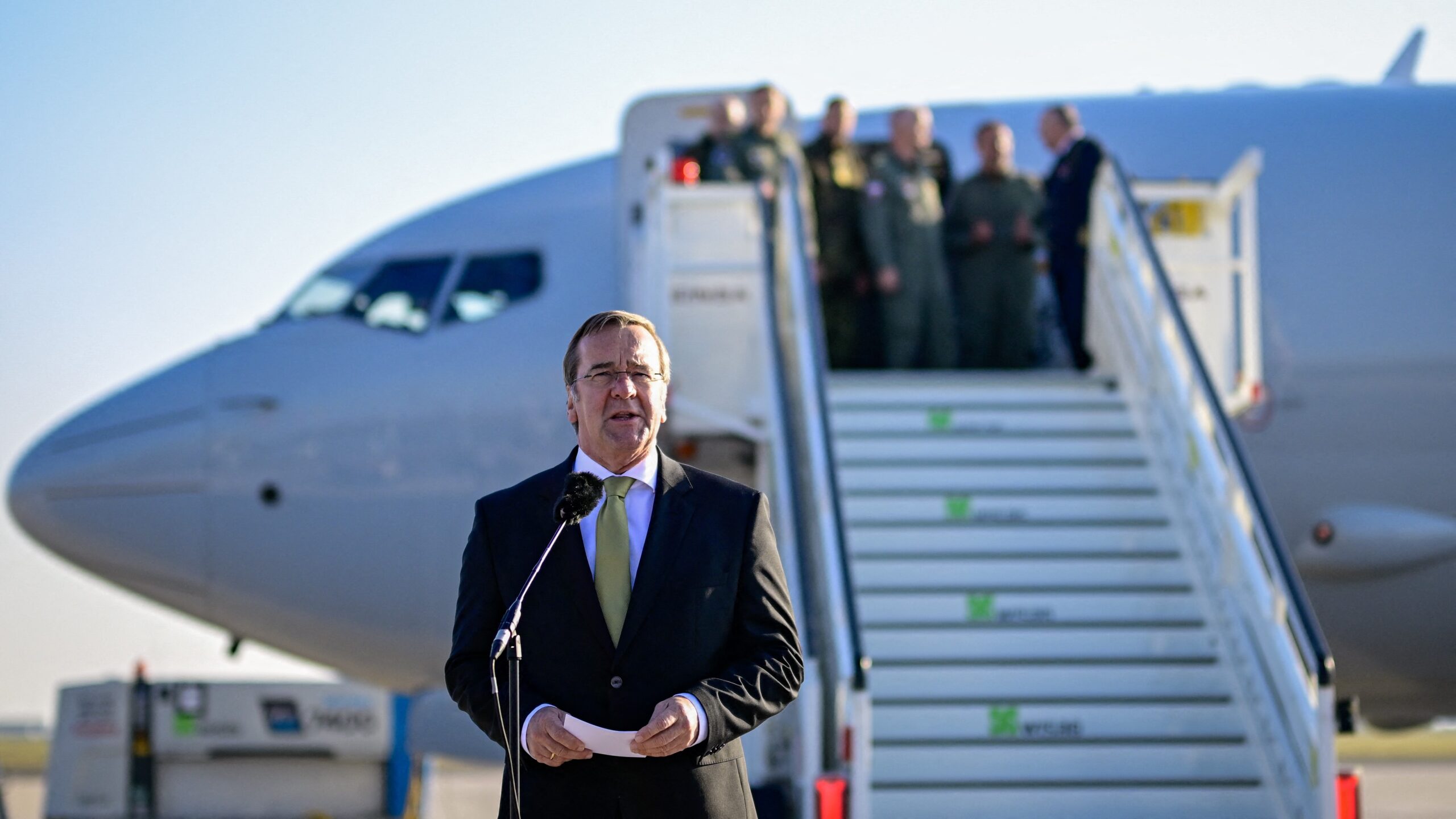 German Defence Minister Boris Pistorius delivers a speech in front of the first German maritime reconnaissance P8-A Poseidon patrol aircraft after it landed, on November 7, 2025 at the military part of Schoenefeld airport near Berlin. (Photo by Tobias SCHWARZ / AFP)