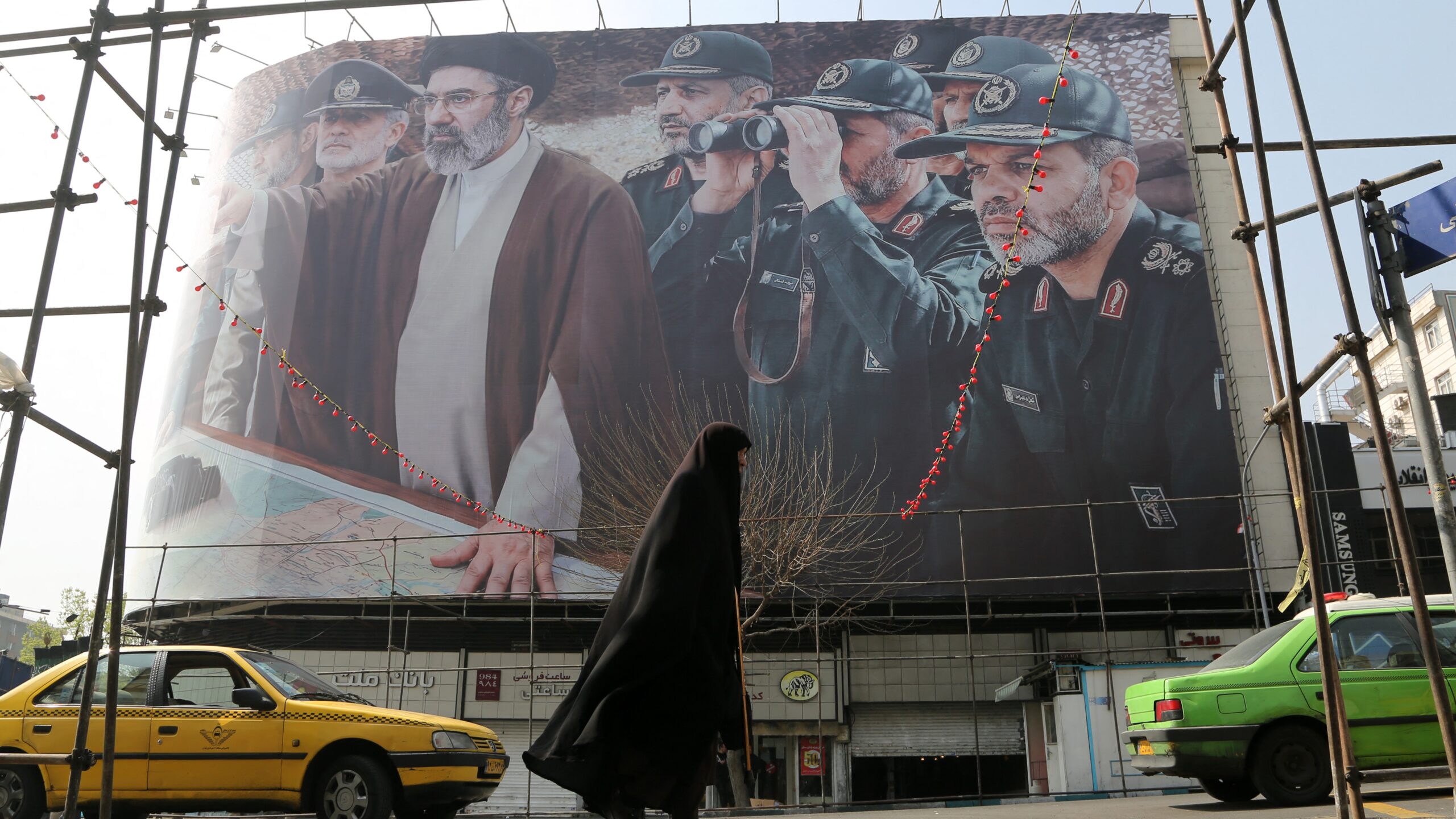 A view of a banner featuring Iranâ€™s new Supreme Leader Mojtaba Khamenei and senior commanders of the Islamic Revolutionary Guard Corps (IRGC) as the attacks by the United States and Israel against Iran continue on March 14, 2026.
