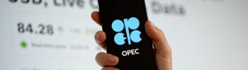 The Organization of the Petroleum Exporting Countries (OPEC) logo is displayed on a mobile phone screen, and a website with a Brent crude oil price chart is seen on a computer screen in Krakow, Poland, on March 3, 2026.